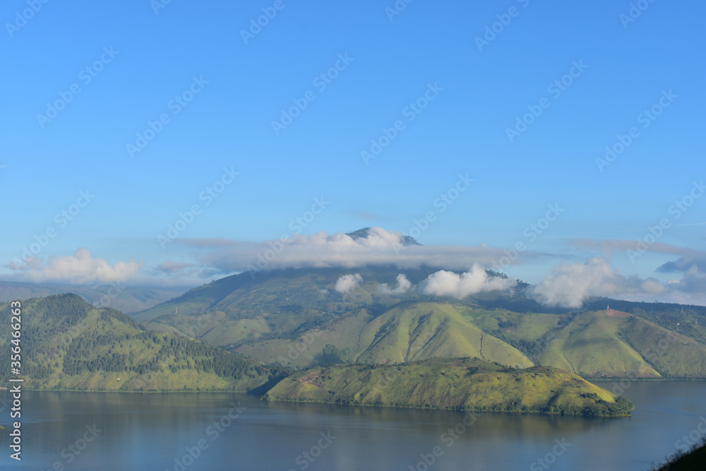 Spring view of green mountain with Toba lake. Samosir island, Indonesia Spring view of green mountain with Toba lake. Samosir island, Indonesia