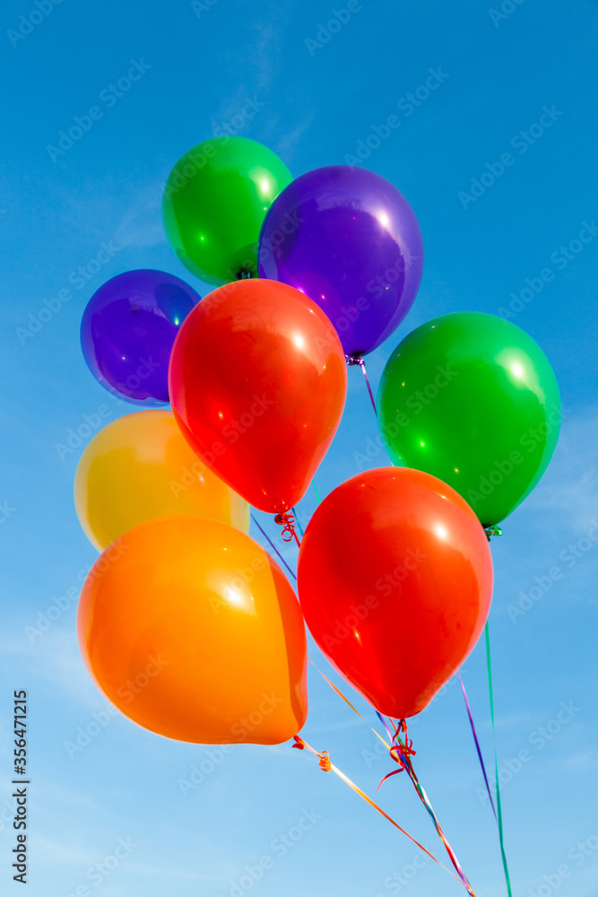 Colorful balloons on a beautiful blue sky Colorful balloons on a beautiful blue sky