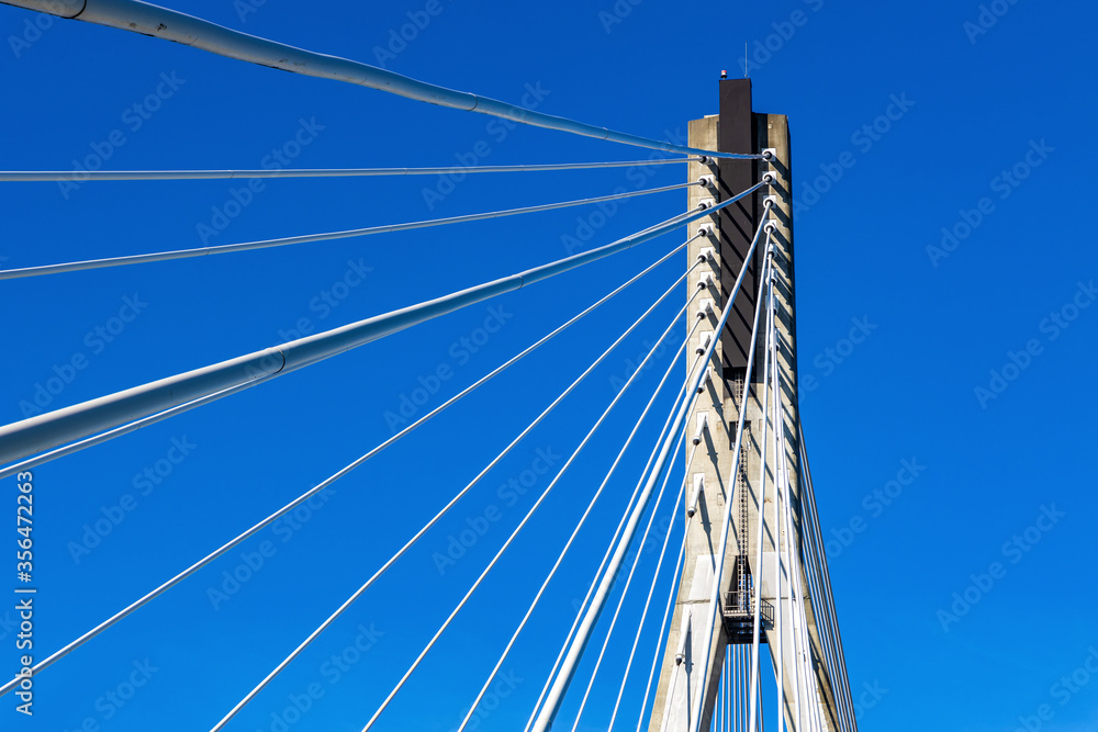 Obraz premium Swietokrzyski Bridge - Most Swietokrzyski - with cable-stayed pylon over Vistula river in Warsaw, Poland