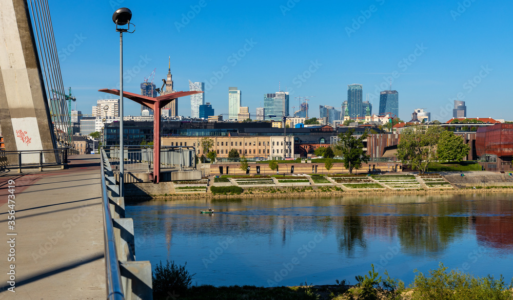 Panoramic view of Srodmiescie city center downtown quarter with Swietokrzyski Bridge - Most Swietokrzyski - over Vistula river in Warsaw, Poland