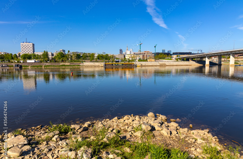 Panoramic view of Srodmiescie city center downtown quarter with Swietokrzyski Bridge - Most Swietokrzyski - over Vistula river in Warsaw, Poland