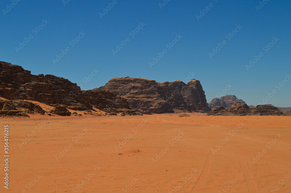 Rock formations and red sand at the Wadi Rum Desert, Jordan Rock formations and red sand at the Wadi Rum Desert, Jordan