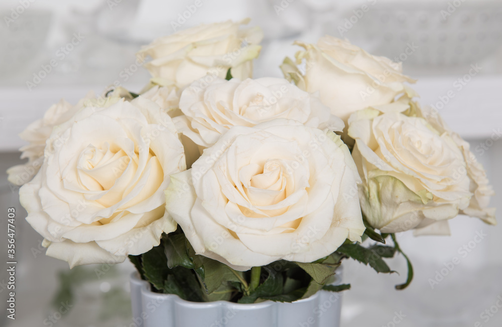 Bouquet of white roses flowers close-up in a vase Bouquet of white roses flowers close-up in a vase