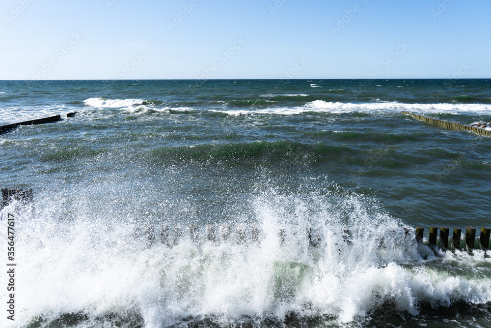 splashing waves of Baltic Sea, waves braking through cutwater splashing waves of Baltic Sea, waves braking through cutwater