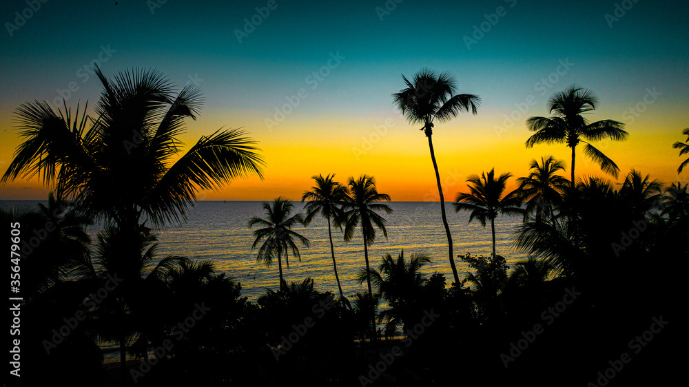 aerial view of an amazing silhouette sunset in La Romana, Dominican Republic, Caribbean Sea 