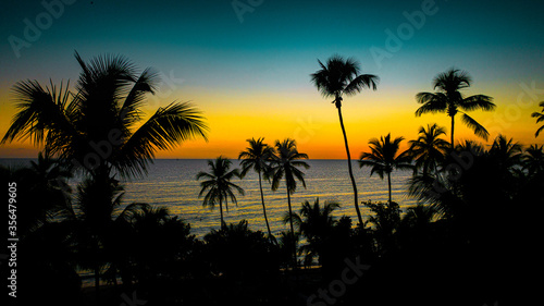 aerial view of an amazing silhouette sunset in La Romana, Dominican Republic, Caribbean Sea 