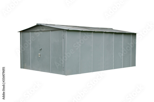 Gray metal garage with closed gate in a residential area of the post-Soviet city. Isolated on a white background.