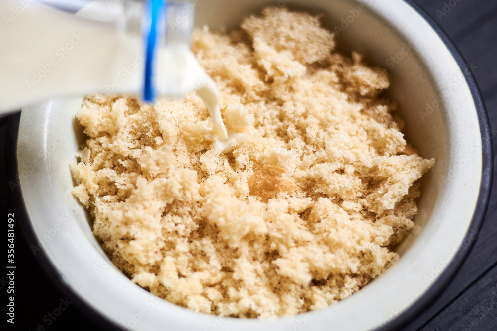Pour milk into a plate with bread to prepare a dish - cutlets. Pour milk into a plate with bread to prepare a dish - cutlets.