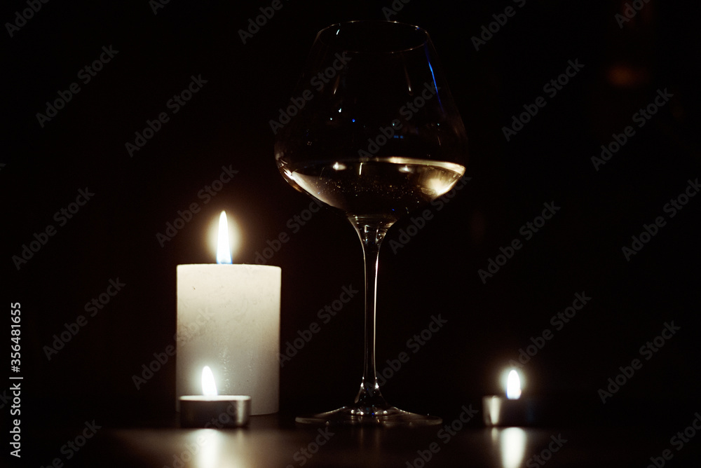 Candles and a glass of wine in the dark. Candles and a glass of wine in the dark.