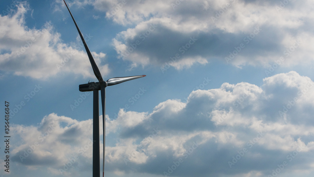 wind turbine in a cloudy sky wind turbine in a cloudy sky