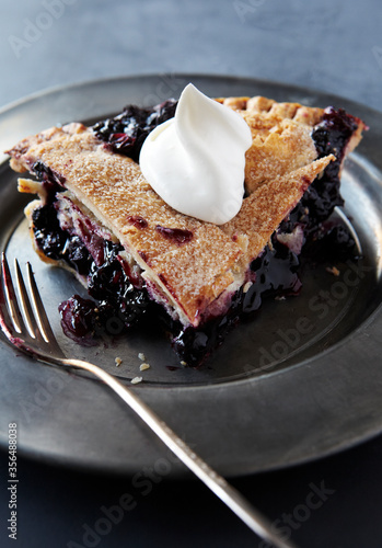 Slice of Blueberry Pie with Whip Cream photo