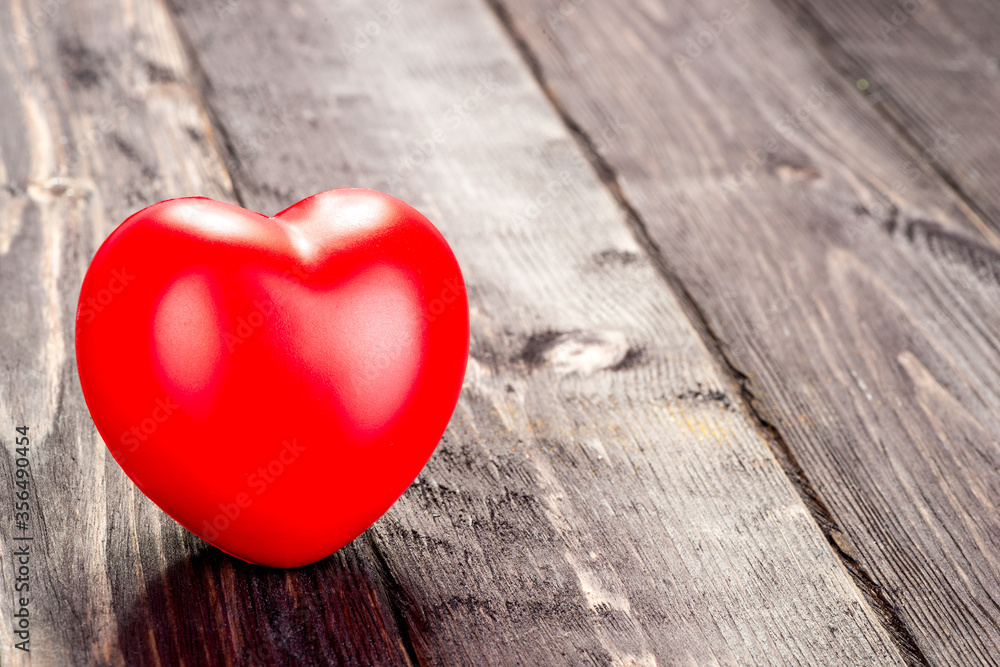 Valentine's day card red heart on a wooden table Valentine's day card red heart on a wooden table