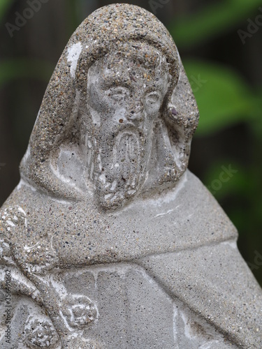 St Fiacre statue in a garden photo