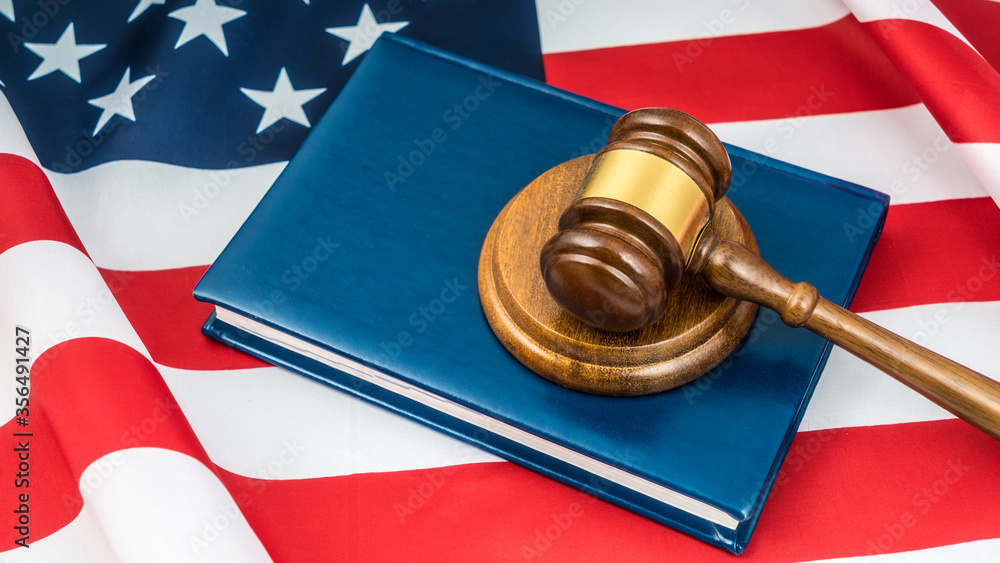 Gavel judge, book of laws, USA flag. America law court constitution