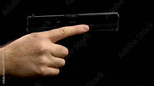 hand holding a gun, reload and misfire