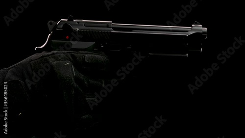 Pistol gun reloading and misfire on black background