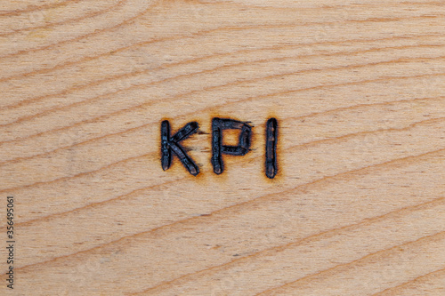 Obraz na plátně an abbreviation KPI - key performance indicator - burned by hand with electric w