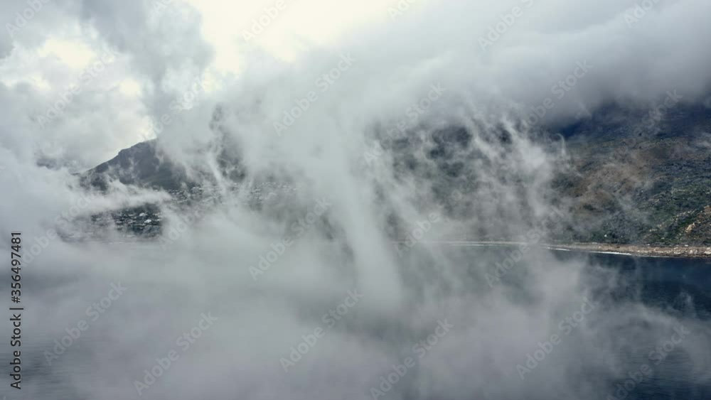 Mountain by the Beachside Covered by Thick Clouds Mountain by the Beachside Covered by Thick Clouds