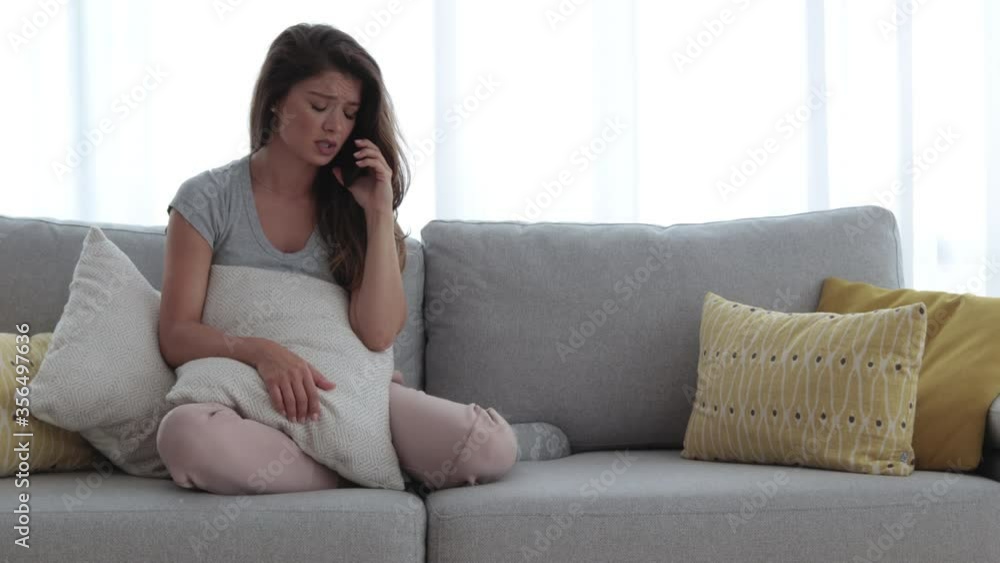 Young beautiful sad girl talking on the phone with her boyfriend and realize that he is breaking up with her over the phone, relationship issues concept Young beautiful sad girl talking on the phone with her boyfriend and realize that he is breaking up with her over the phone, relationship issues concept