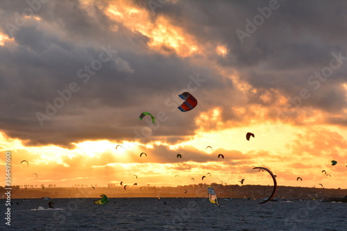 Kitesurfing at Pucka Bay during beautiful sunset photo