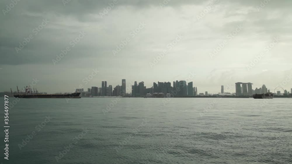 Ships are anchored in the port of Singapore. Ships stand by.
Hundreds of cargo ships anchored off the coast of Singapore.