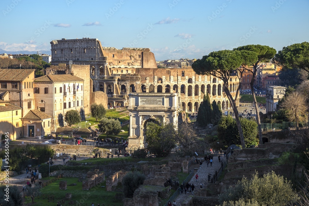 Ruins of Roman forum with Colosseum on background , Rome, Italy