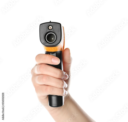 Wallpaper Mural Woman holding non-contact infrared thermometer on white background, closeup Torontodigital.ca