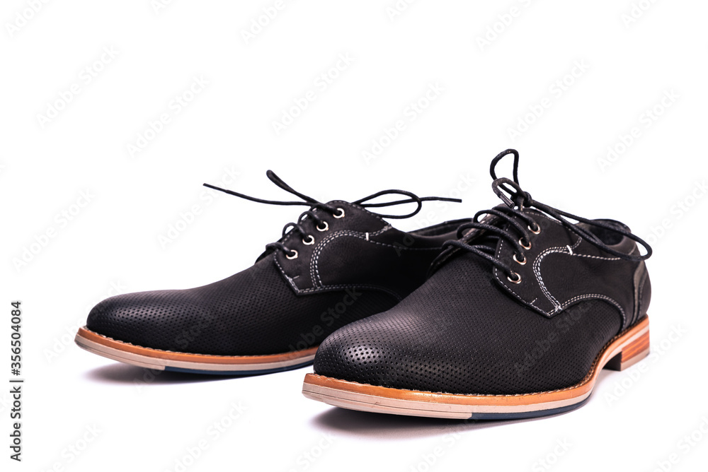 simple black men's shoes on a white background, unbranded and unlabeled