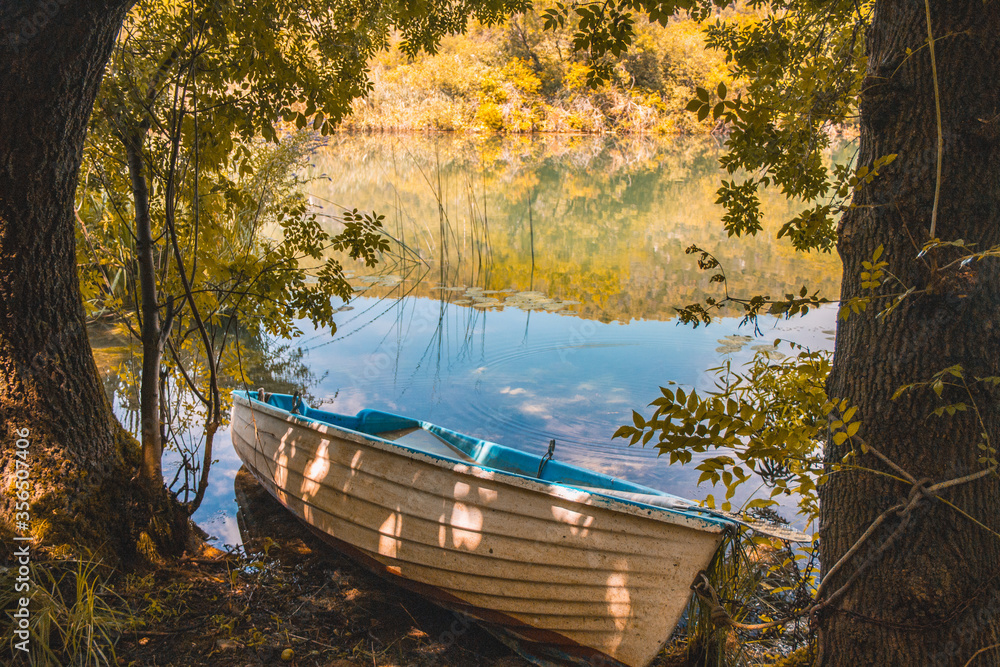Abandoned boat at the riverside at Krka National Park in Croatia Abandoned boat at the riverside at Krka National Park in Croatia