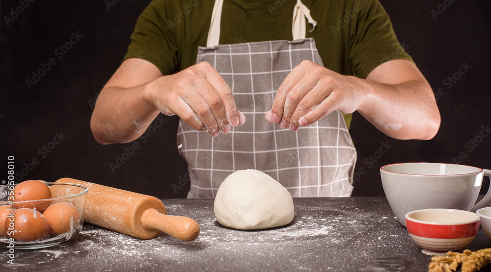 Fototapeta premium A man is baking homemade bakery