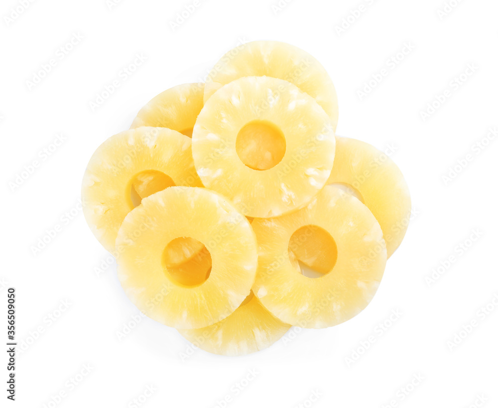 Delicious canned pineapple rings on white background, top view