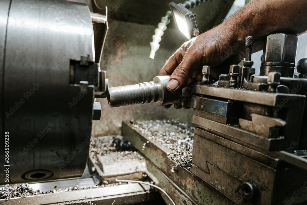 Close up shot of manual worker hands. Factory for industrial production of hydraulic hoses. Close up shot of manual worker hands. Factory for industrial production of hydraulic hoses.