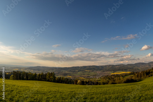 Landscape with lots of clouds in the mountainous area of the Beskydy Mountains during a sunny afternoon. © Lukas