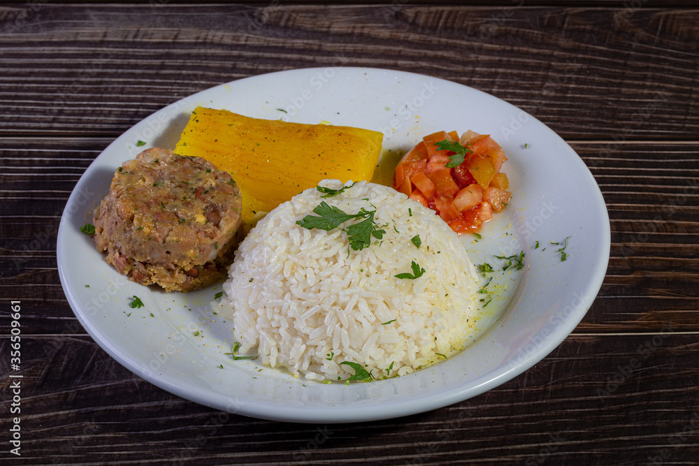 Rice and beans, traditional brazilian dish with manioc and salad. Rice and beans, traditional brazilian dish with manioc and salad.