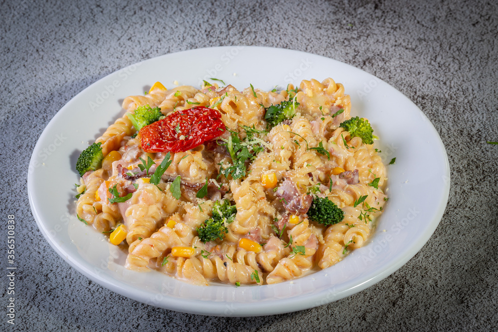 Penne pasta with bechamel sauce and vegetables Penne pasta with bechamel sauce and vegetables