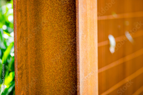 the building made of corten steel beams is protected from electrochemical corrosion. a special alloy of steel, with a protective film, a brown patina that does not oxidize the internal structure. photo