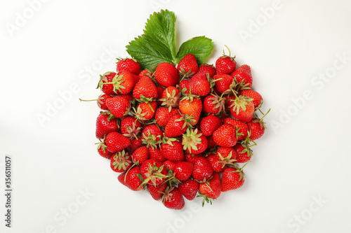 Tasty red strawberry on white background, top view. Summer berry