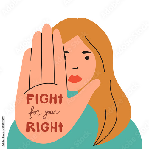 Young woman showing stop sign with raised hand. Woman portrait. Prohibition symbol.
