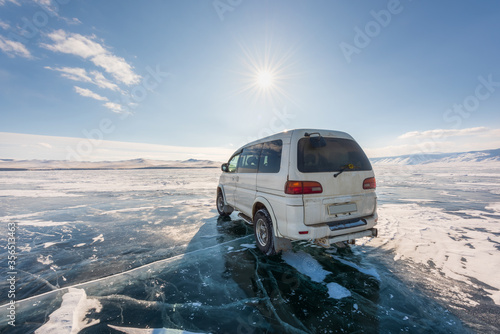 Baikal Lake. Winter travel on the ice by car.