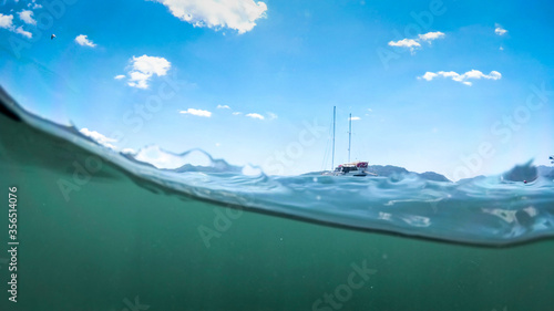 Obraz na plátne Underwater image of yacht on the sea surface