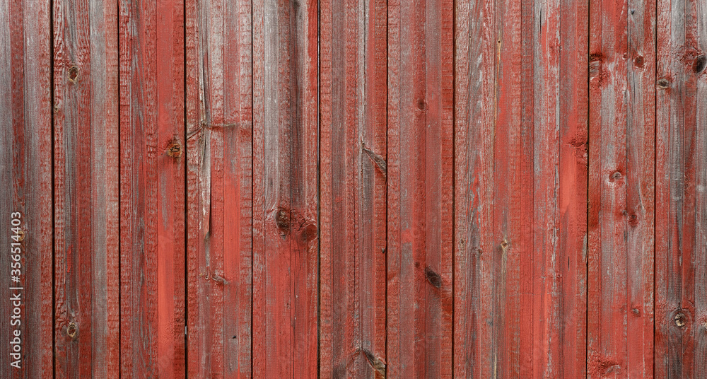 Old gray with shabby red paint wooden wall, aged background and texture. Rustic wooden board of fence. natural patterns background Old gray with shabby red paint wooden wall, aged background and texture. Rustic wooden board of fence. natural patterns background