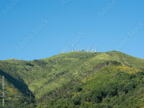 TV mast and telecommunication antennas on top of a mountain photo