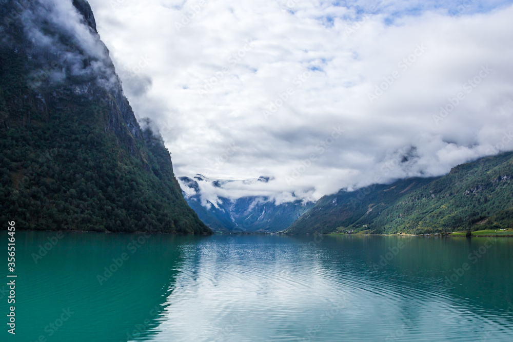 Obraz premium clouds over the lake in the mountain of Norway