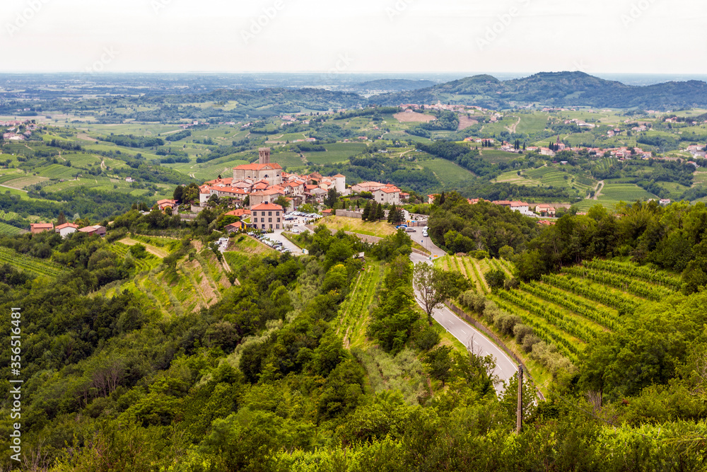 The view from the heights of the mountains, fields, and vineyards of the Italian foothills of the Alps