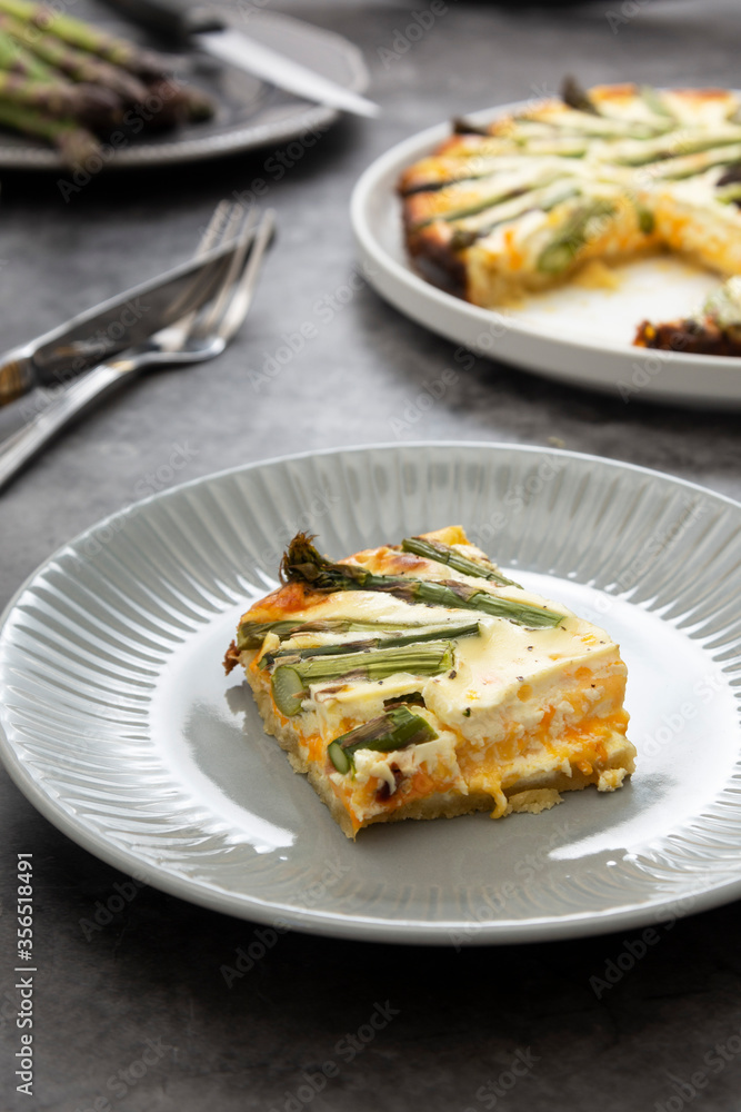 Slice of asparagus tart. Homemade pie filled with fresh asparagus. Vegan food. Slice of asparagus tart. Homemade pie filled with fresh asparagus. Vegan food.