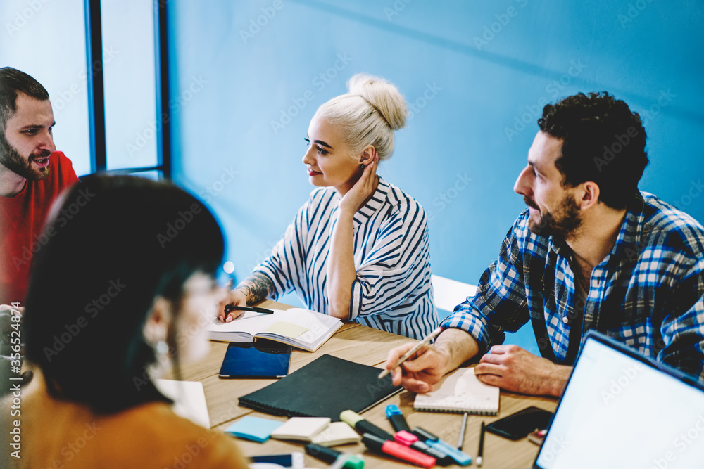 Skilled group of employees team working on business strategy share ideas and talking . Skilled group of employees team working on business strategy share ideas and talking .