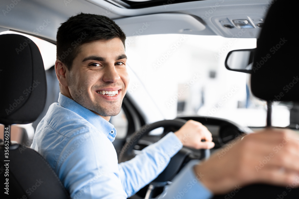 Happy Young Man Sitting In His New Auto Happy Young Man Sitting In His New Auto
