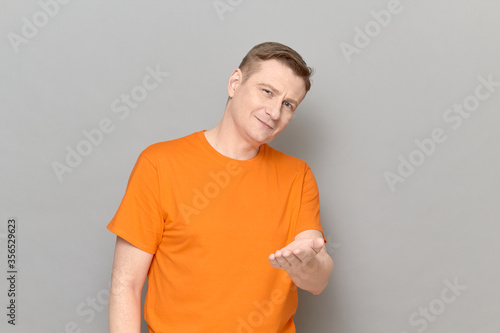 Fotografie Portrait of man stretching hand to you and expressing cordiality