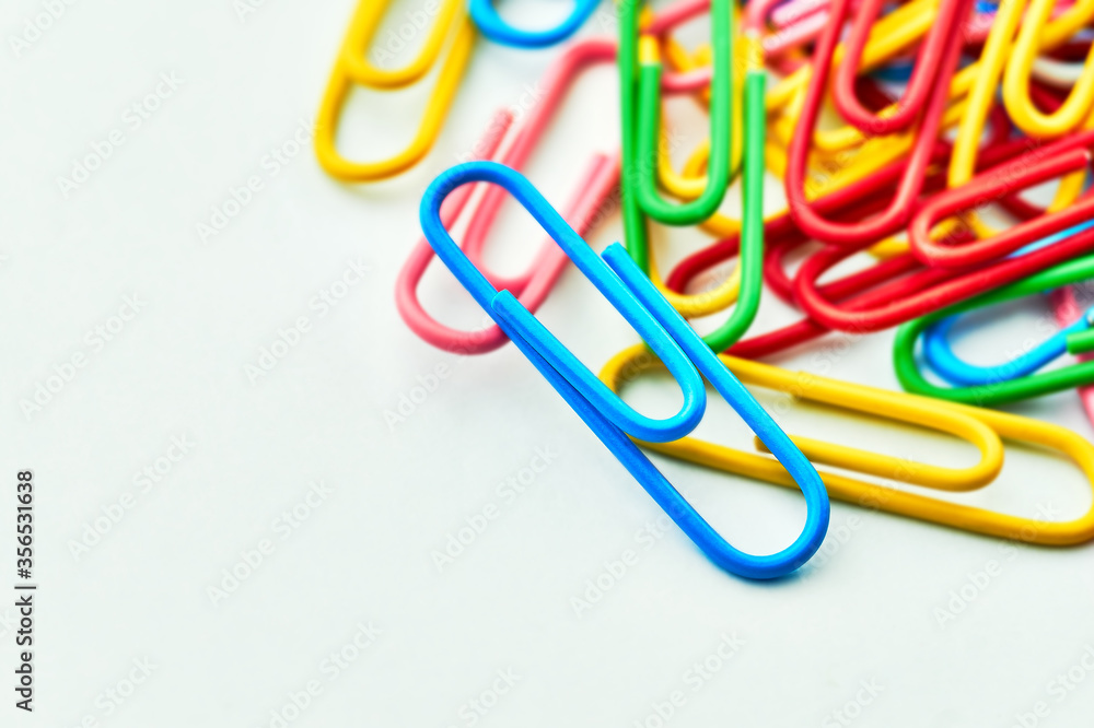 Colored paper clips on white background Close up Macro Selective focus Colored paper clips on white background Close up Macro Selective focus
