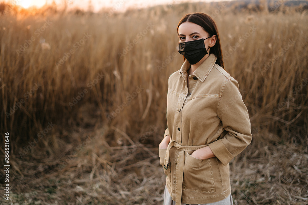 Woman in a protective mask while walking